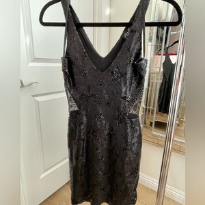 Black sequins dress with star decal, gently worn